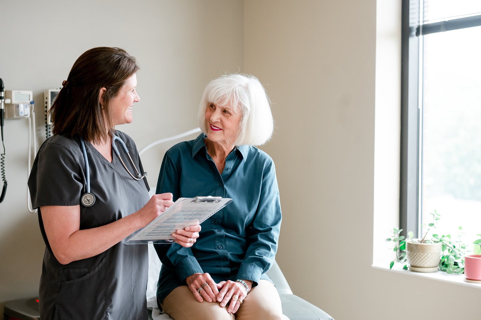 Doctor and patient filling out forms